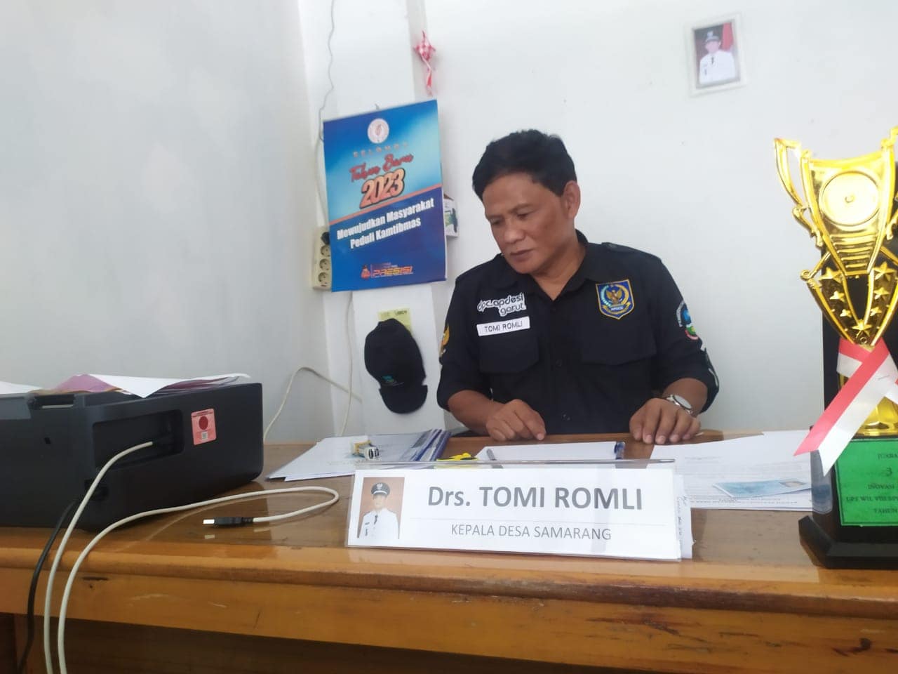 Drs. Tomi Romli Kades Samarang