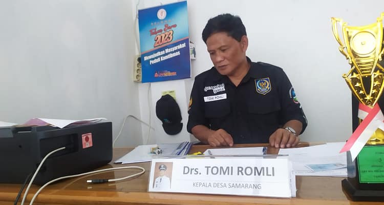 Drs. Tomi Romli Kades Samarang Drs. Tomi Romli Kades Samarang